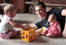 Playing with Daddy and her little friend, Claire.